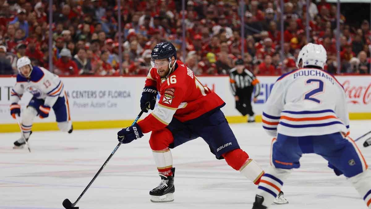 Florida Panthers forward Aleksander Barkov (16) controls the puck against Edmonton Oilers defenseman Evan Bouchard (2) during the second period in game two of the 2024 Stanley Cup Final at Amerant Bank Arena.