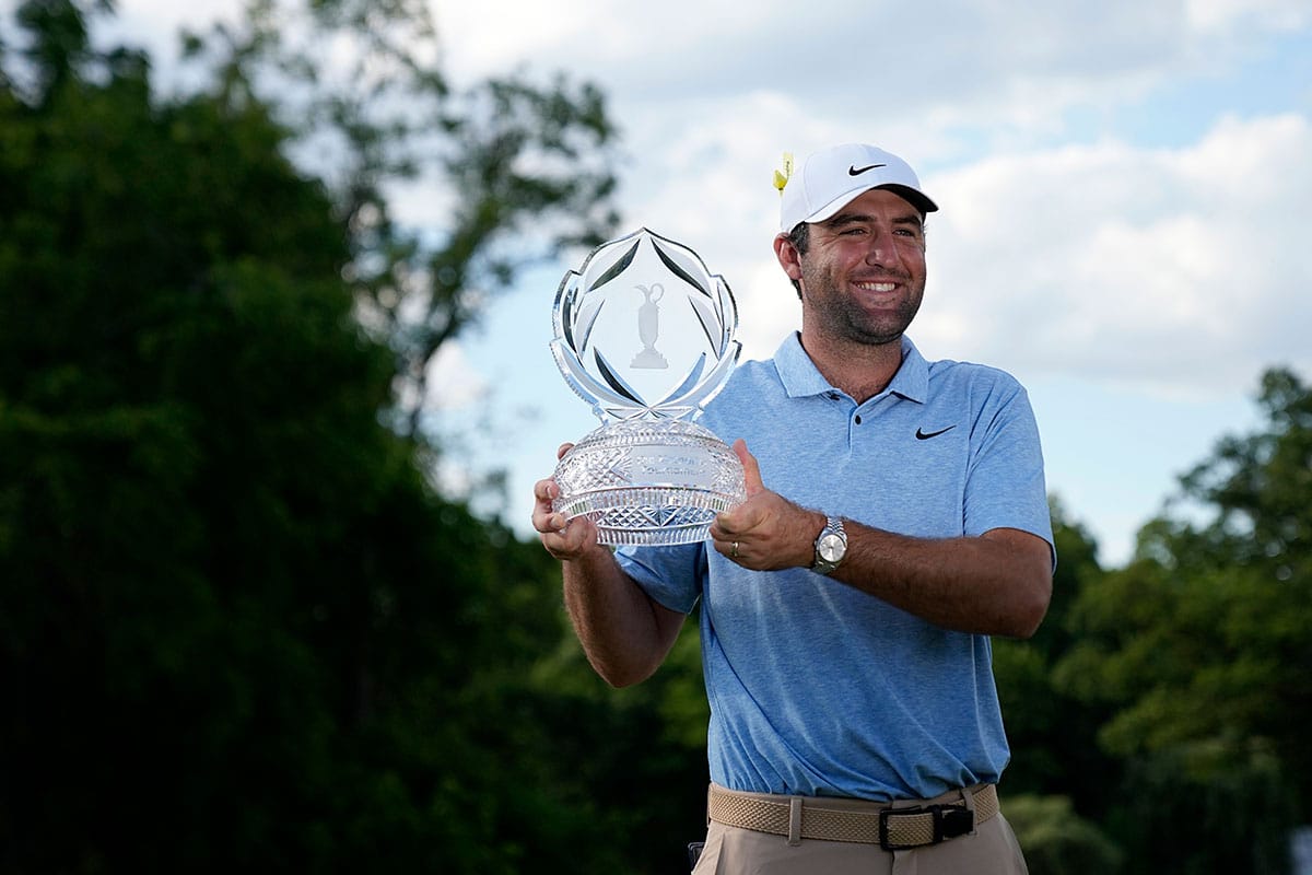 Scottie Scheffler poses for a photograph with the trophy for the Memorial Tournament at Muirfield Village Golf Club.